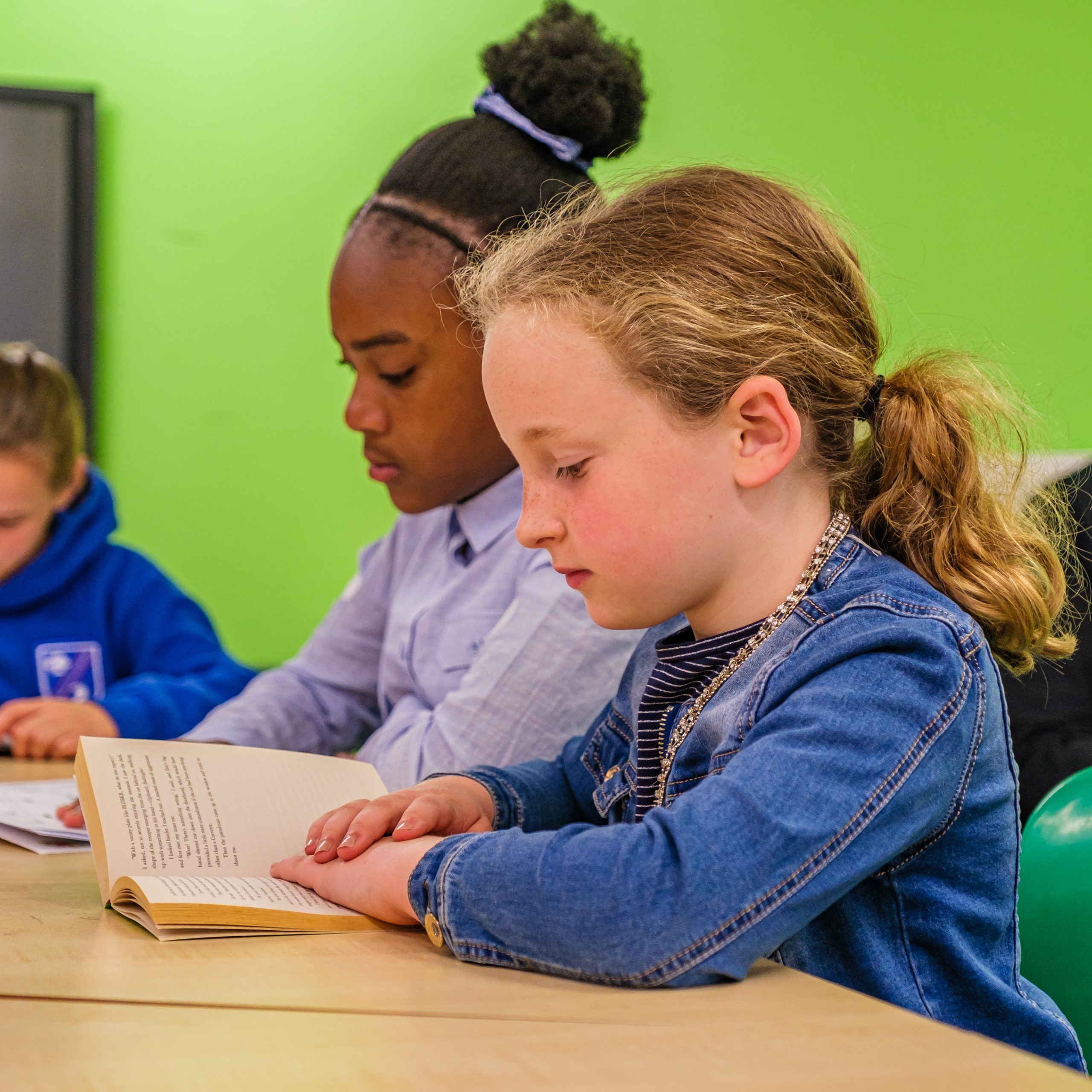 Students practising reading and comprehension skills during 11 Plus tuition